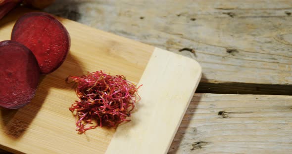 Raw beetroot on chopping board 4k alt