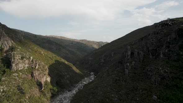 Aerial view of steep rocky canyon in Geres National Park in Portugal, drone shot