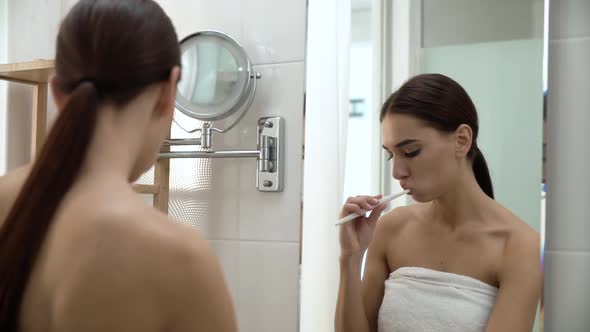 Dental Health. Woman Brushing Teeth In Bathroom alt