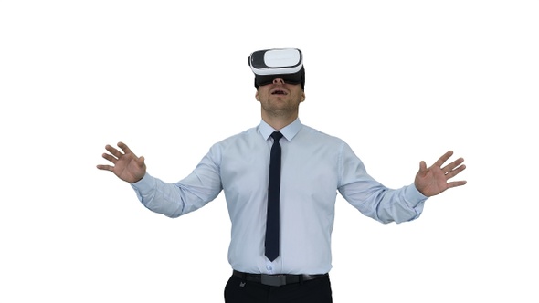 Astonished young businessman wearing VR glasses Concept alt