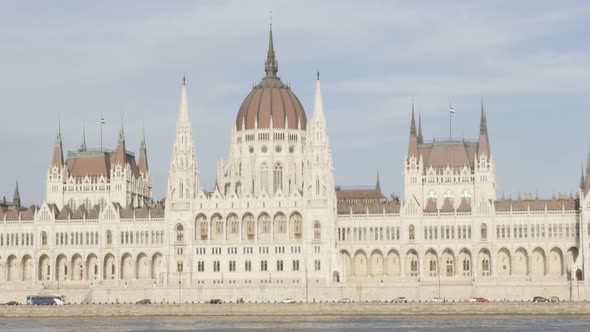 Hungarian parliament building located on river Danube  and city of Budapest by the day 4K 2160p Ultr alt