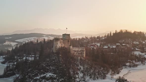 Stunning sunset at picturesque Niedzica Castle at Lake Czorsztyn, aerial alt