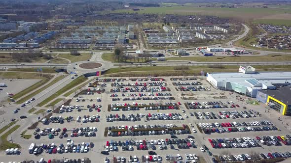 Top aerial view of many cars on a parking lot or sale car dealer market. alt