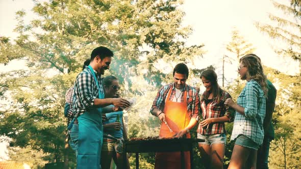 Happy Friends Enjoying Barbecue Party alt