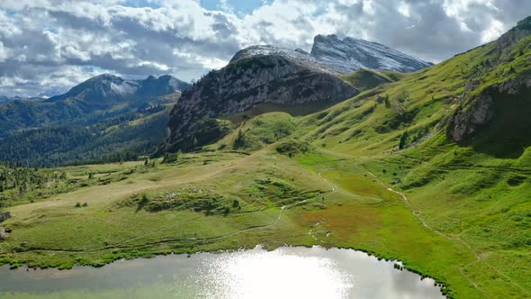 Passo Falazarego and lake in Dolomites, view from above alt
