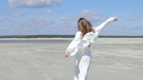 Beautiful Woman Walking on Shore