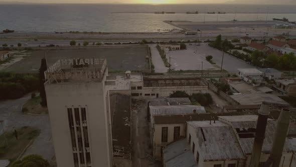 Aerial view of a abandoned area and building located nearby the sea in Patras.