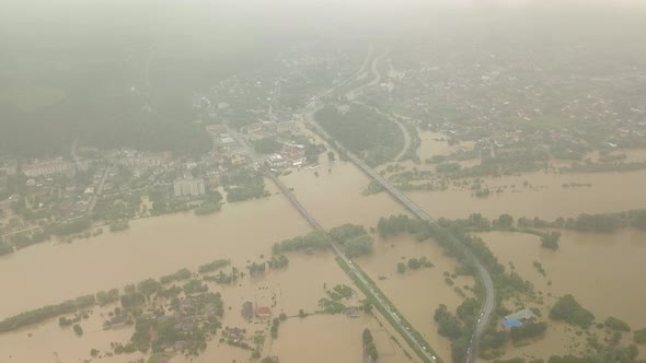 Natural Disasters. Destructive Flood After Torrential Rains. Top View of Flooded City, Cars and