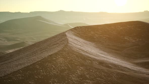 Aerial View on Big Sand Dunes in Sahara Desert at Sunrise alt