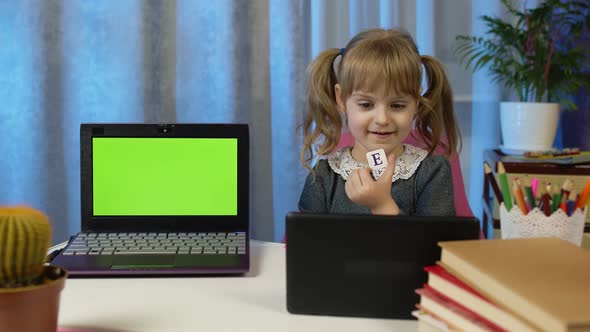 Child Girl Pupil Doing Homework with Teacher Using Digital Tablet at Home Laptop Green Screen alt