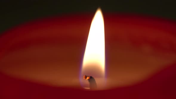 A Candle Flame Flutters in the Breeze - Macro Detail alt