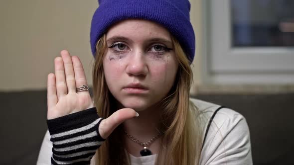 A Tearful Teenage Girl Asks for Help