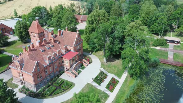 Jaunmoku Brick Medieval Castle Near Tukums, Latvia  Aerial Dron 4k Shot Jaunmokas Manor Park. alt