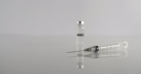 Syringe And Vaccine On White alt