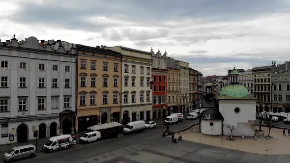Aerial footage of the a typical street in Krakow Poland showing Renaissance style building alt