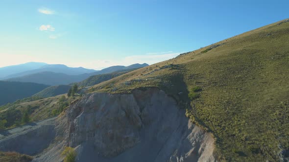 Aerial Drone View Of Green Hills and Large Flock of Sheep Grazing on a Mountain Meadow in the Summer