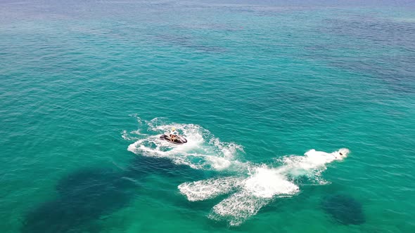 Aerial View of a Person Flyboarding in the Sea. Elounda, Crete, Greece