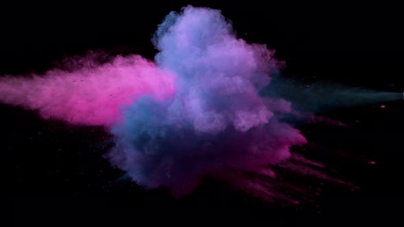 Super Slowmotion Shot of Color Powder Explosion Isolated on Black Background alt