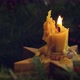 Burning candle in christmas wreath on rustic table, top view - VideoHive Item for Sale