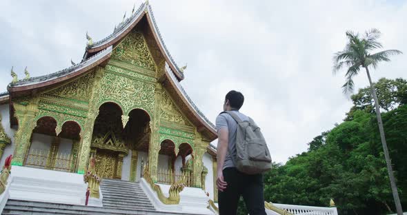 Tourist Walking In Front Of Temple alt
