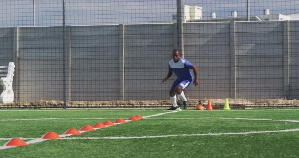 Soccer player training on field alt