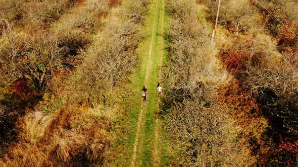 Aerial View Cute Girls Having Ride Together in Rural Landscape 