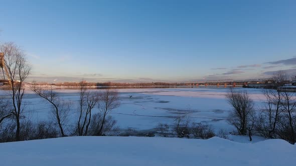 Timelapse Winter Landscape on a Frozen Lake on a Sunny Day with Fishermen on Ice