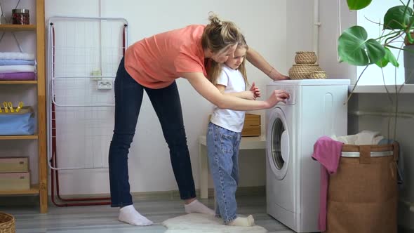 Mom and Daughter Turn on Washing Machine Woman Explain How to Use Washer Appliance Spbd alt