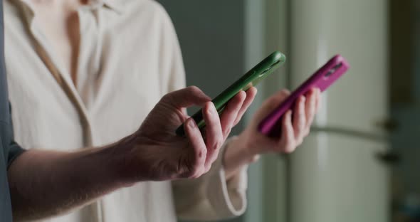 Two People at the Same Time Take Out Their Smartphones and Type Messages