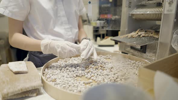 Female Hands In Gloves Preparing Tapioca Balls In A Milk Tea Cafe In Bangkok Thailand alt