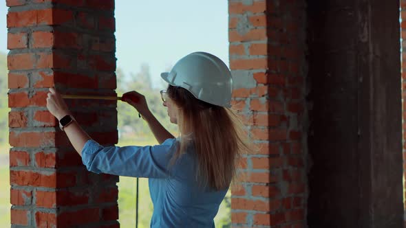 Civil Engineer Checking Construction Site. Woman Architect In Helmet Inspecting Building. alt