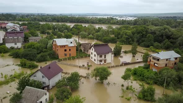 Aerial view of flooded houses with dirty water of Dnister river in Halych town, western Ukraine. alt