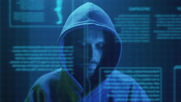 Cybercriminal Hacker Closeup Enters Text on the Keyboard