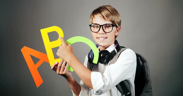 English Boy Holding English Letters Isolated