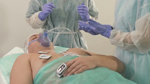 Doctors are Preparing for a Medical Examination of a Male Patient alt