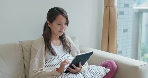 Woman work on tablet at home alt