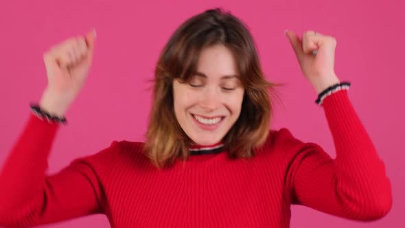 Close Up of a Girl That is Celebrating Surprised and Amazed for Success with Arms Raised alt