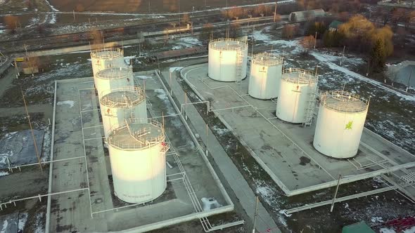 Aerial footage of big fuel reservoires in petrol industrial zone. alt