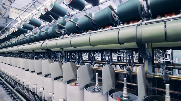 Thread Spools in the Industrial Sewing Machinery alt