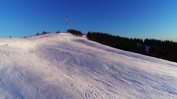 Flying Over Winterland, Mountain Snow Covered Winter Landscape.