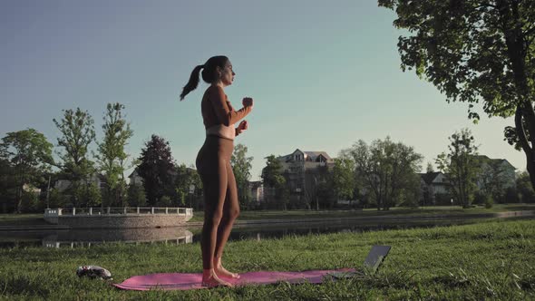 Woman training outside in park