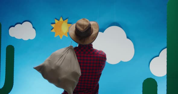 Man with Sack Pretending Horseback Riding alt