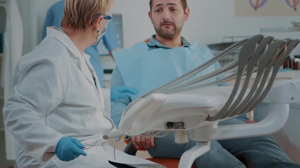 Dentistry Expert Using Dental Tools to Examine Cavity Problems alt