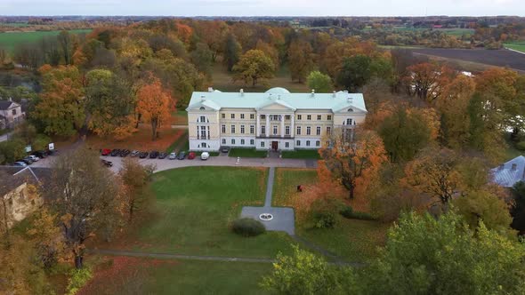 Autumn Aerial Landscape of the City Mezotne and Palace With Park Near Lielupe River, Latvia 4K Video alt