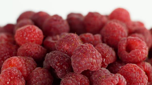 Eco bright colorful berry raspberry rotates 360 on a white background. Close-up of loose raspberry