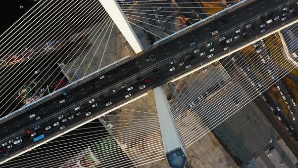 Vertically Down View on the Road with Dense Traffic of the Cablestayed Bridge alt