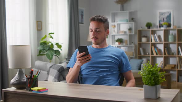 Young Handsome Man Makes an Online Order and the Package Falls to Him From Above alt