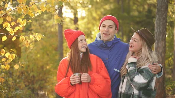 Camping Tent Camp in Nature Happy Caucasian Friends in Autumn at Nature Forest Hike