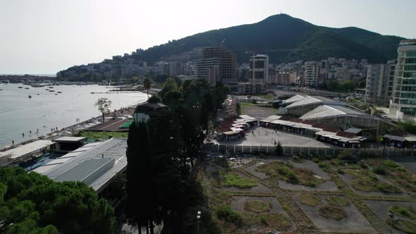 Aerial View Budva Beach By Sea with Sun Loungers and People Seashore Montenegro alt