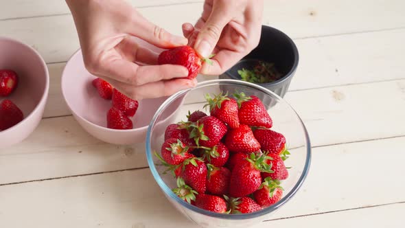 Close Up Female Hands Peels Strawberries, Stock Footage | VideoHive